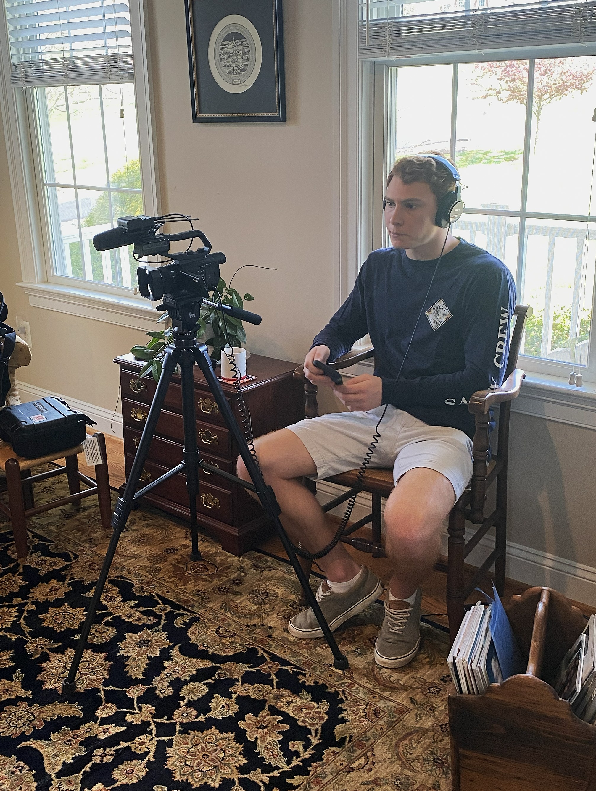 Matt Nolan sits beside a video camera while recording a pre-trip interview.